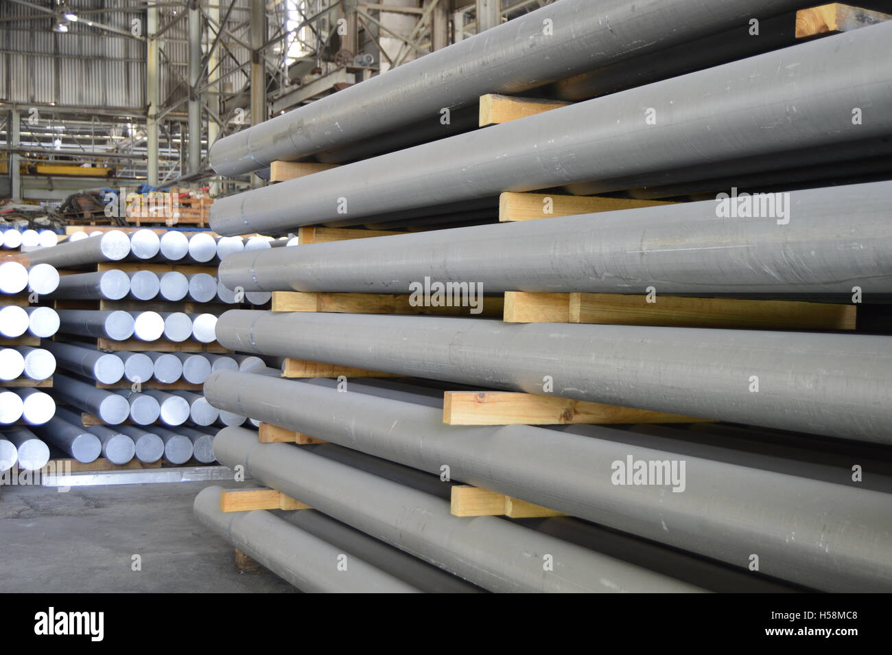 primary aluminum metal cylinders employed in the extrusion process. Stock Photo