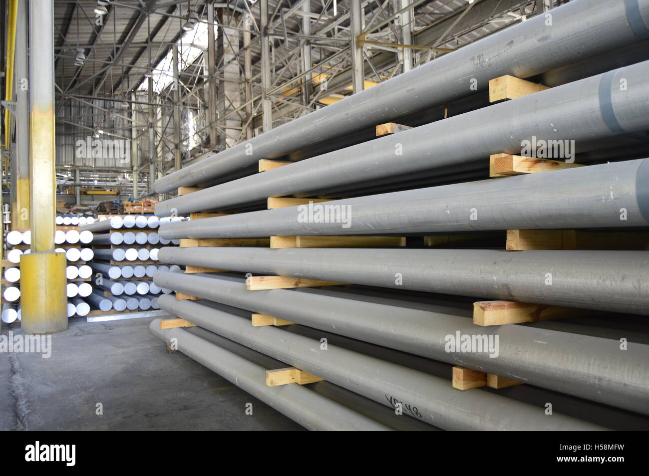 primary aluminum metal cylinders employed in the extrusion process. Stock Photo