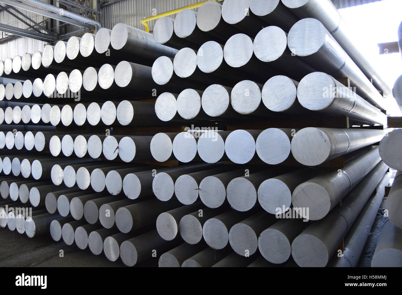 primary aluminum metal cylinder employed in the extrusion process. Stock Photo