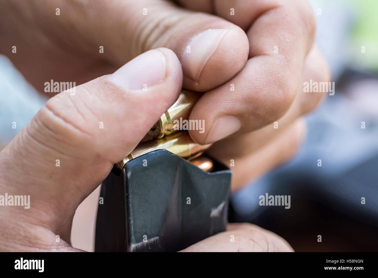 Load 9mm Ammo in the Pistol Clip Close Up. Hands, Bullets, Magazine and Handgun Stock Photo Alamy