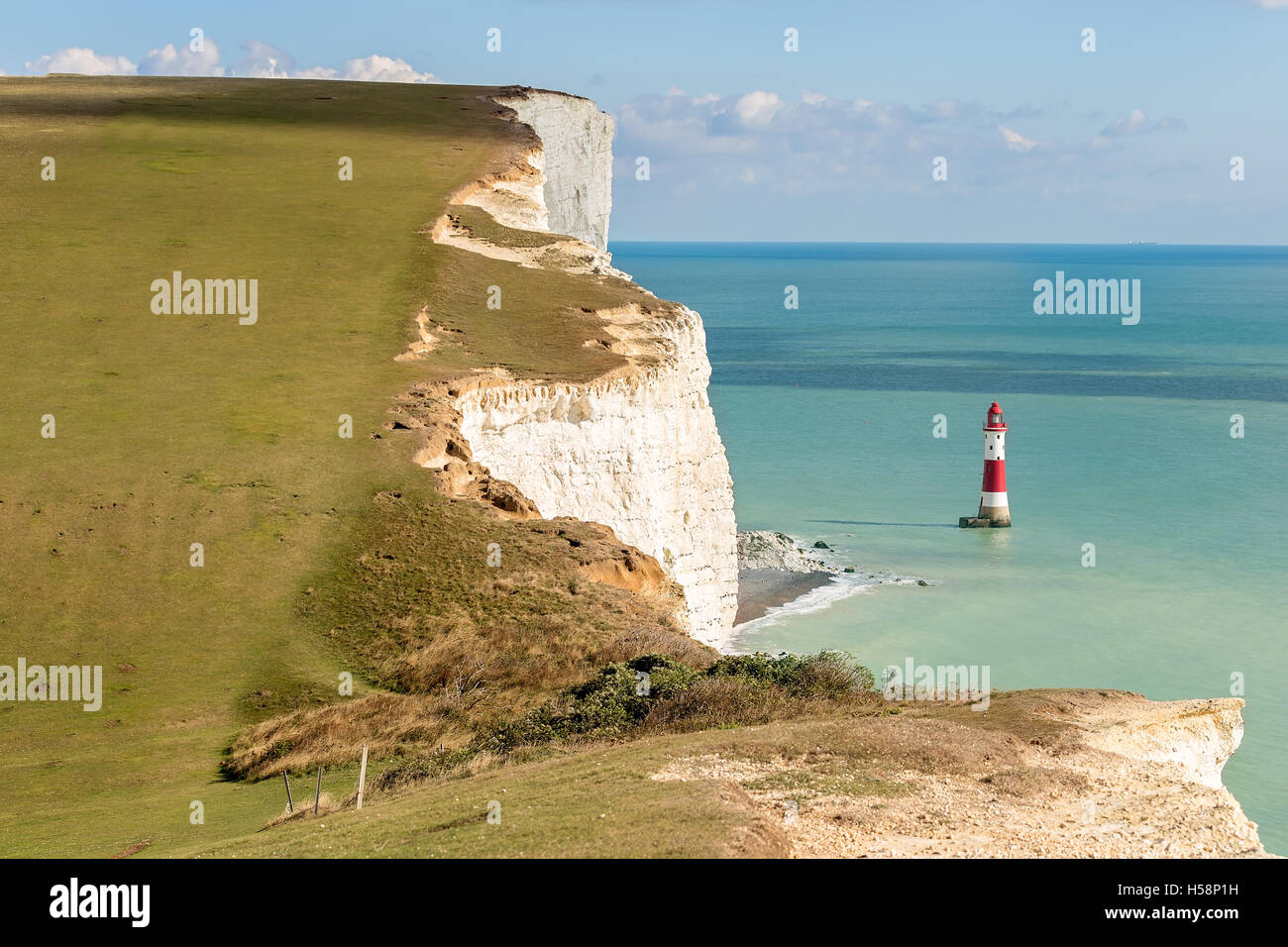 White chalk cliffs and Beachy Head Lighthouse, East Sussex, England Stock Photo