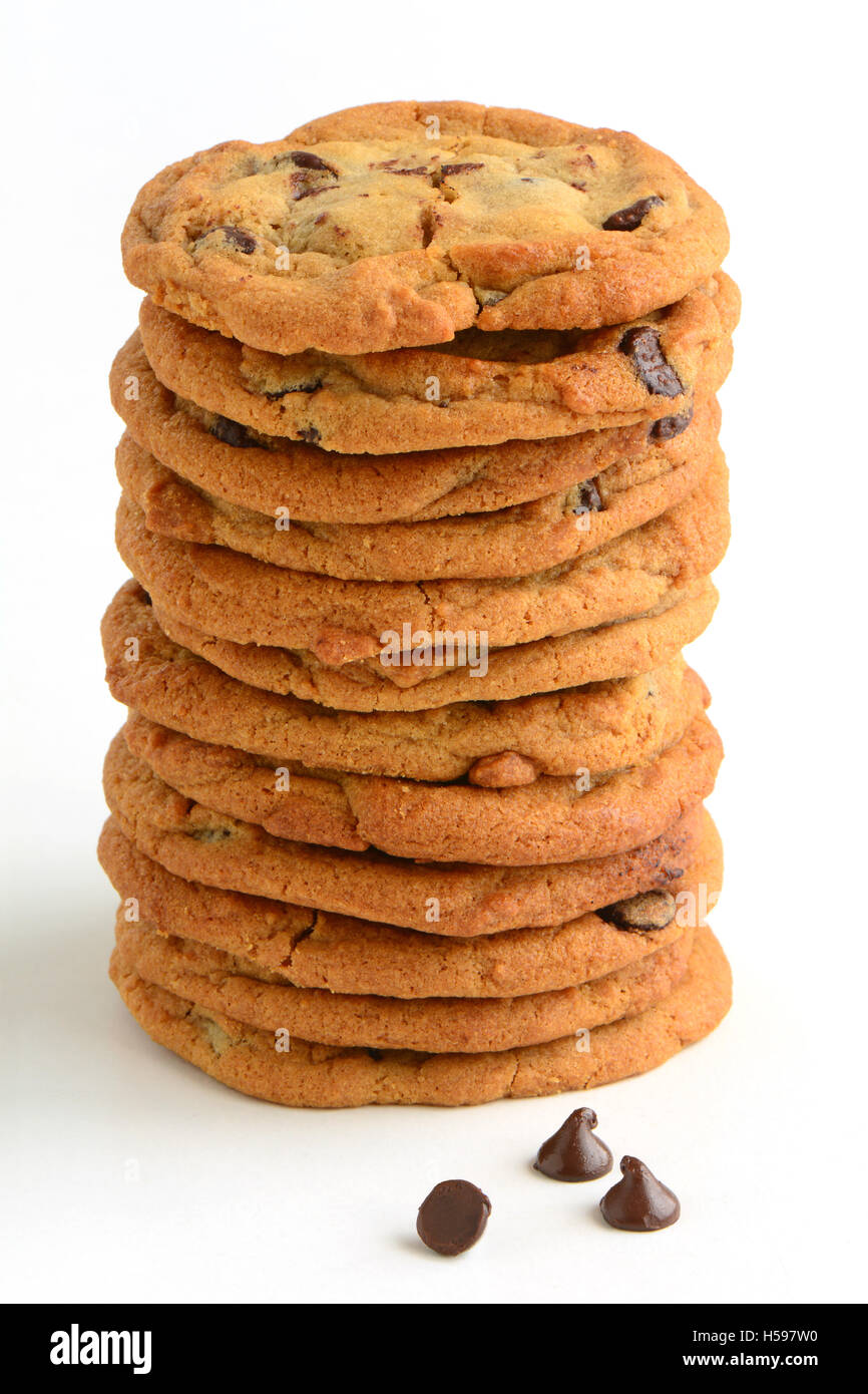 One dozen fresh baked chocolate chip cookies on white background in horizontal format.  Macro with shallow DOF.  Natural light. Stock Photo