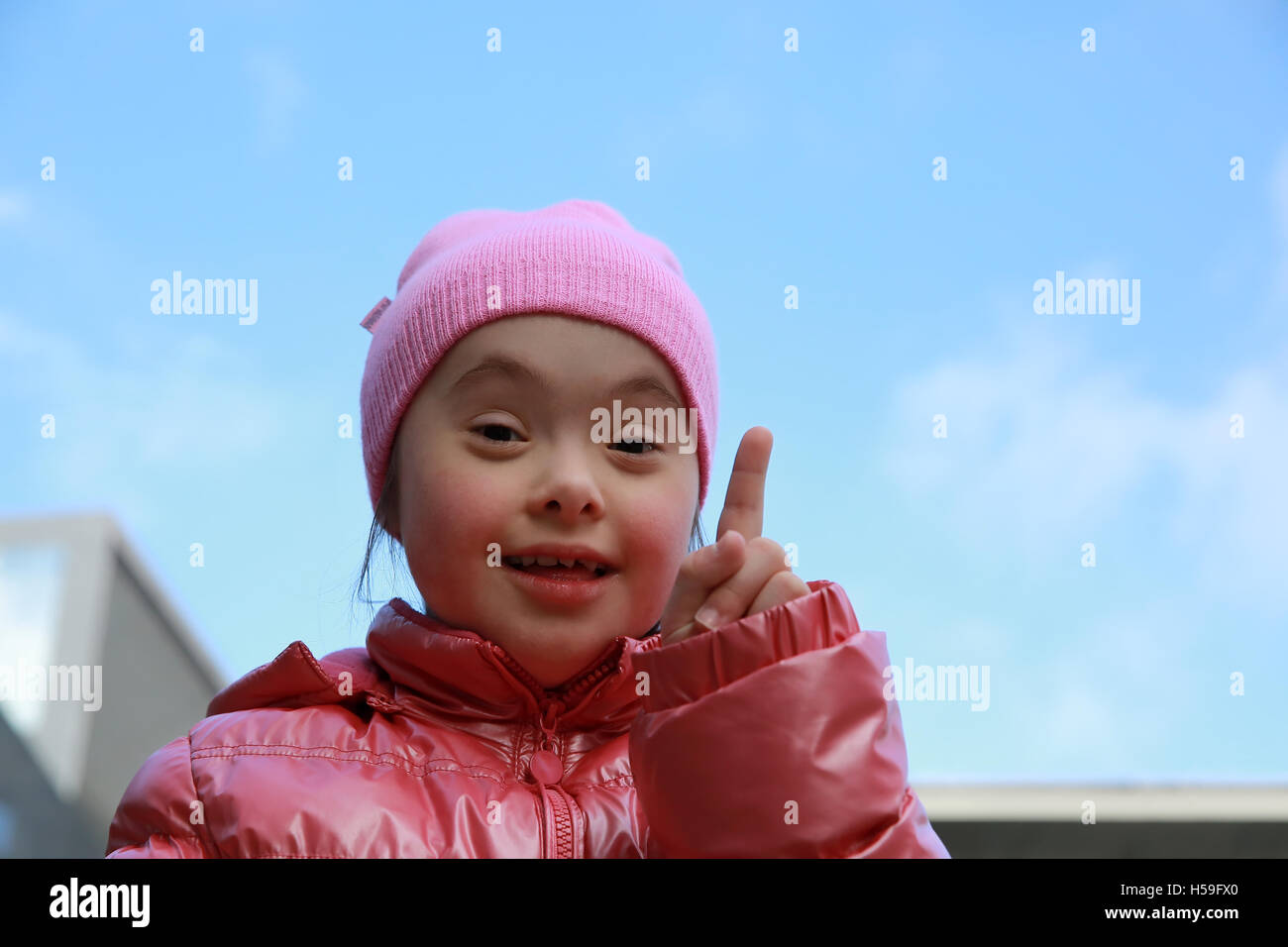 Portrait of beautiful girl on background of the blue sky Stock Photo ...