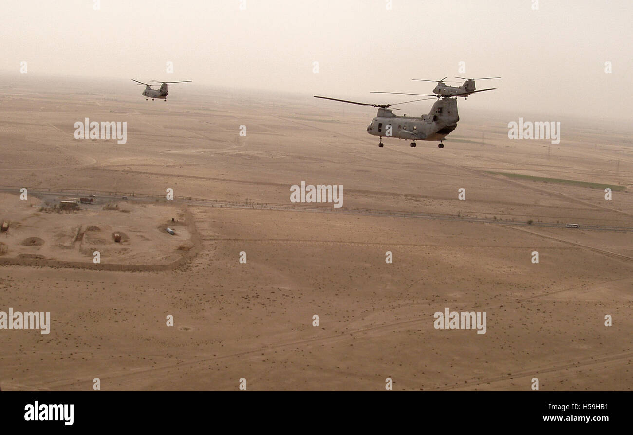 19th Oct. 2003 U.S. Marine Corps CH-46E Sea Knight helicopters fly low across the desert just south of Basra in southern Iraq. Stock Photo