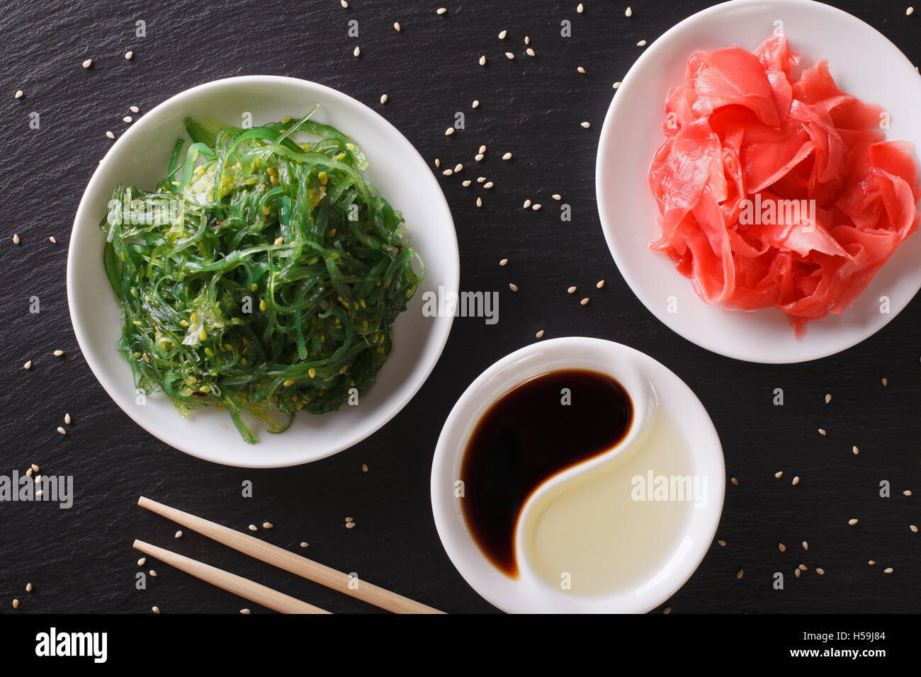 Japanese wakame salad and pickled ginger on the table close-up. horizontal top view Stock Photo