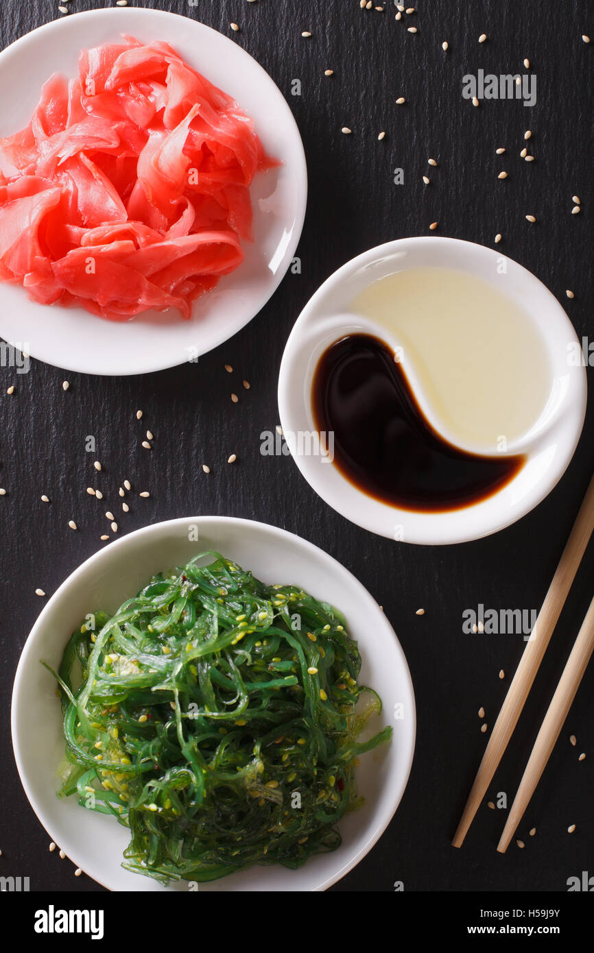 Japanese Chuka Salad with wakame and pickled ginger on the table close-up. vertical top view Stock Photo