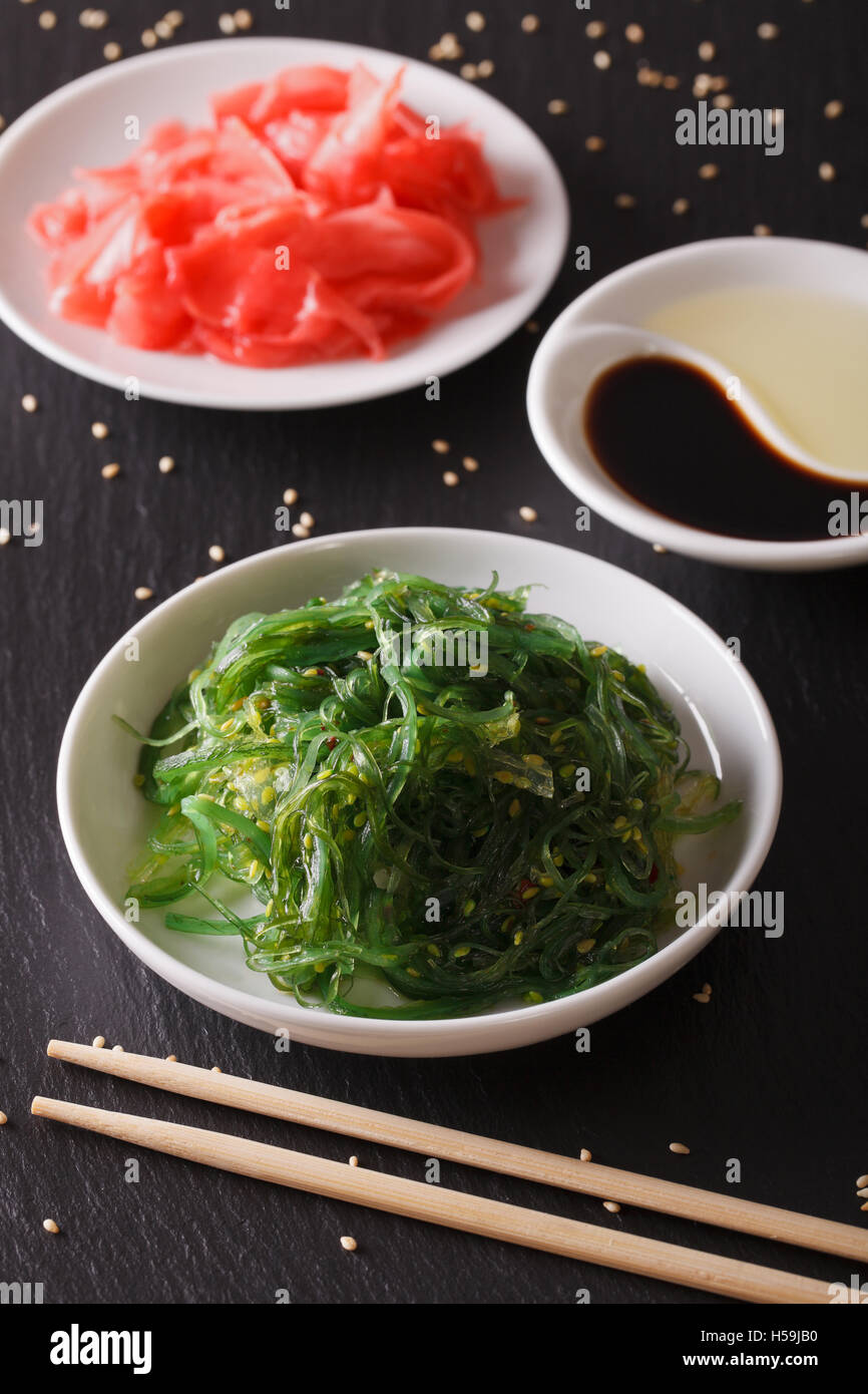 Japanese Chuka Salad with wakame and pickled ginger on the table. vertical Stock Photo