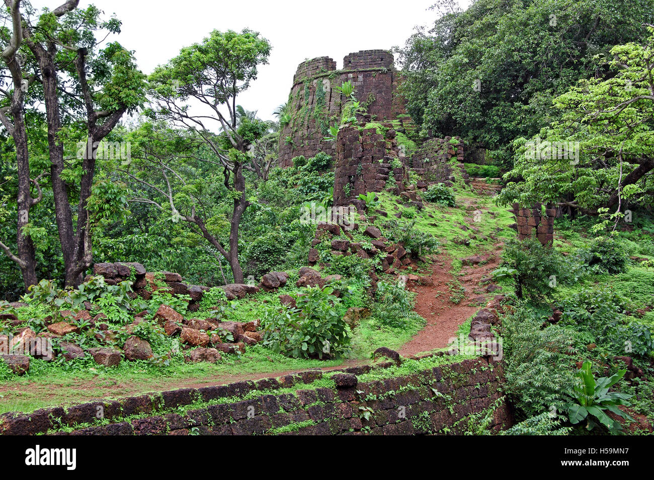 Ruins of turret and other structures of Cabo de Rama Fort in Goa, India. A centuries old fort, last owned by the Portuguese Stock Photo