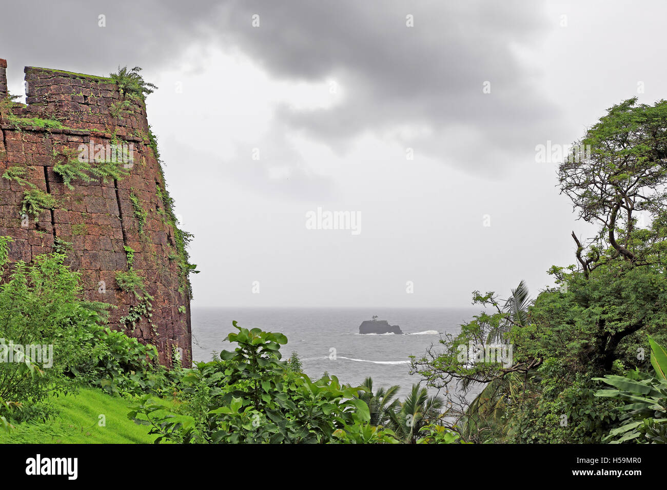 Cabo de Rama Fort turret with sea view in Goa, India. Centuries old fort, built on a cliff on sea coast. Stock Photo