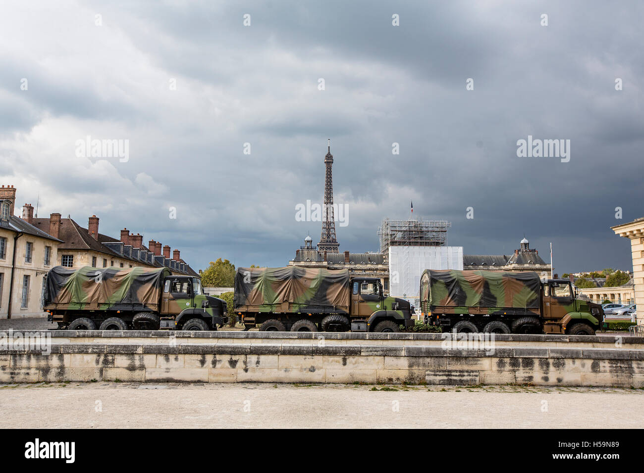 Military vehicles are parked outside the Ecole Militaire (IRSEM), Paris, as part of the state of emergency. Stock Photo