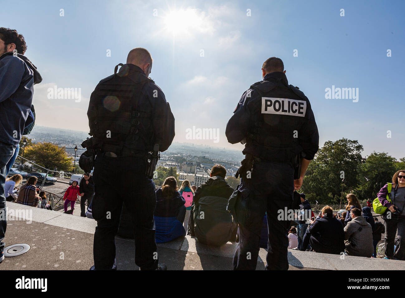 French police patrol the area around the popular tourist attraction Sacre Coeur, Paris, as part of the state of emergency. Stock Photo