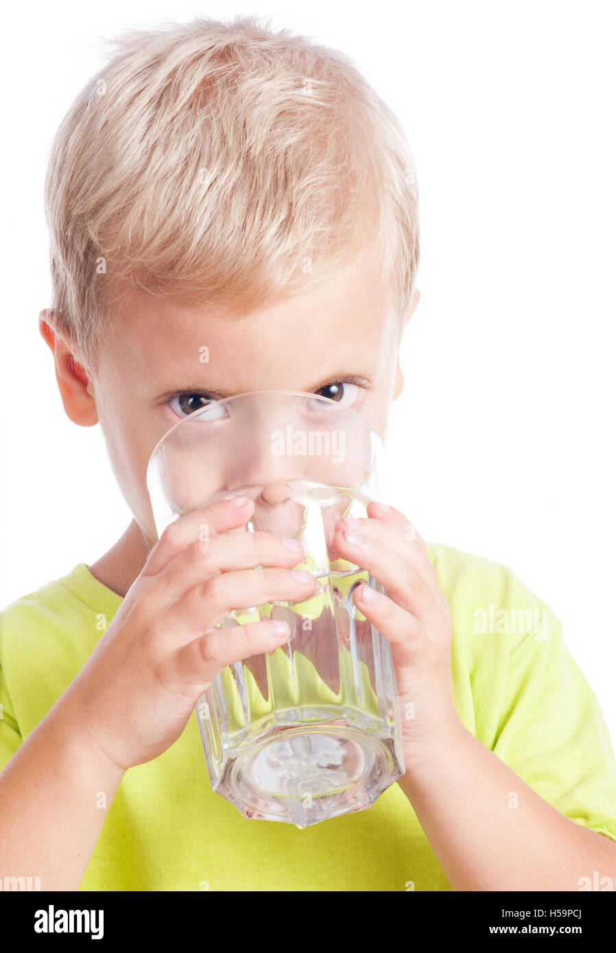 The boy drinks water from a glass Stock Photo Alamy