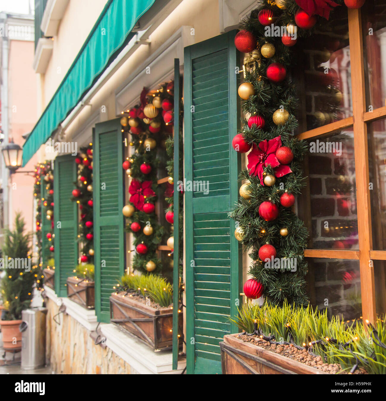 Christmas Red ball decorated windows on vintage house Stock Image