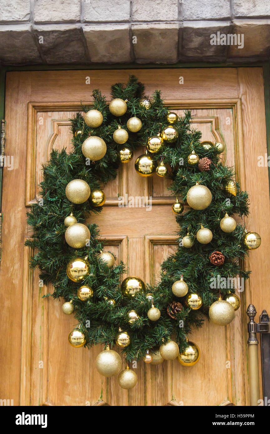 Christmas wreath with baubles and cones on a door Stock Photo Alamy
