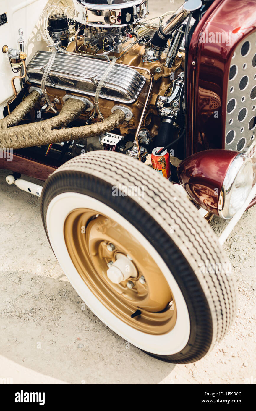 The front passenger side corner of a newly built rat rod sits quietly in the dust. Stock Photo