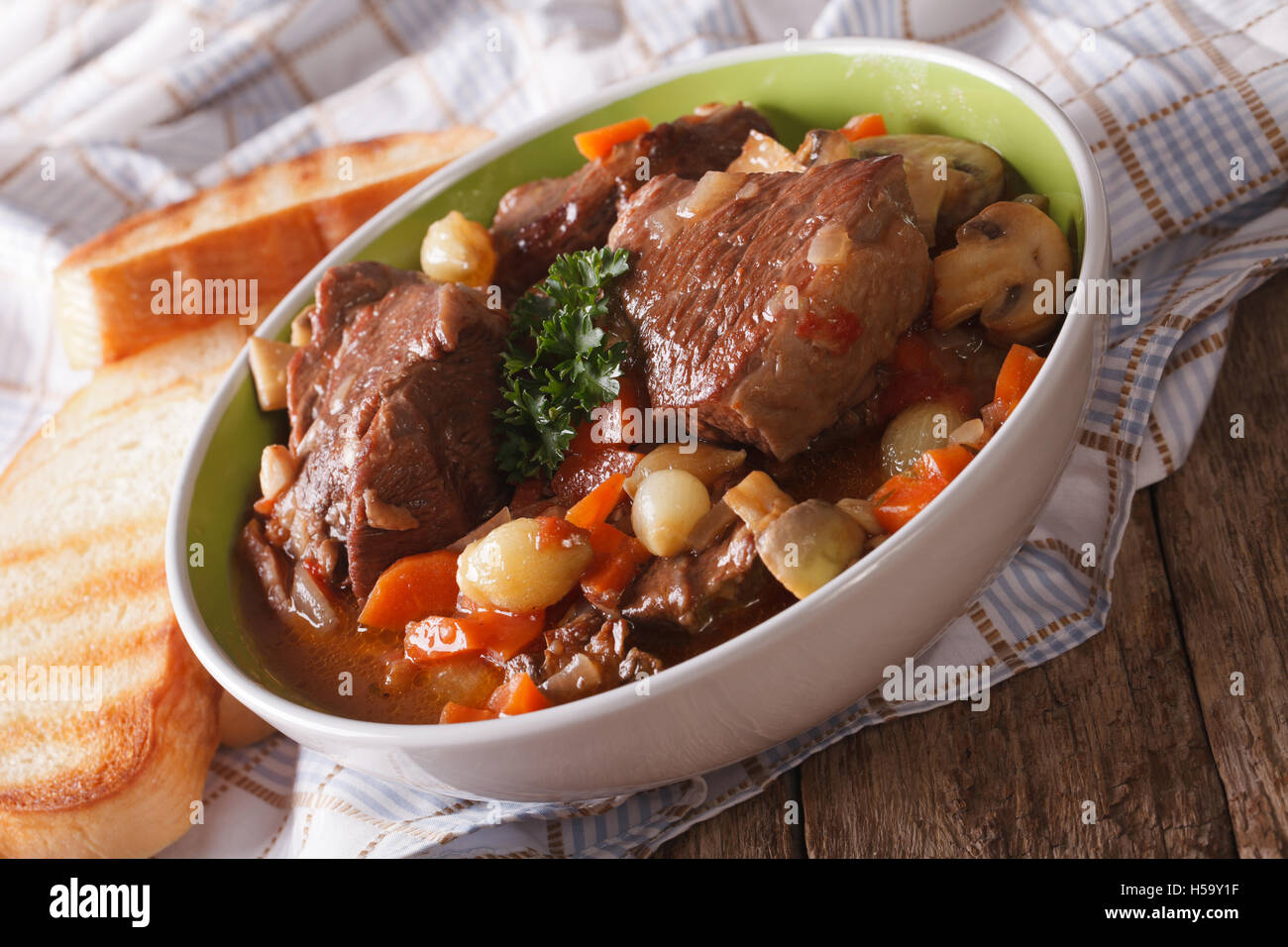 French cuisine: beef Bourguignon close up in a bowl on the table. horizontal Stock Photo