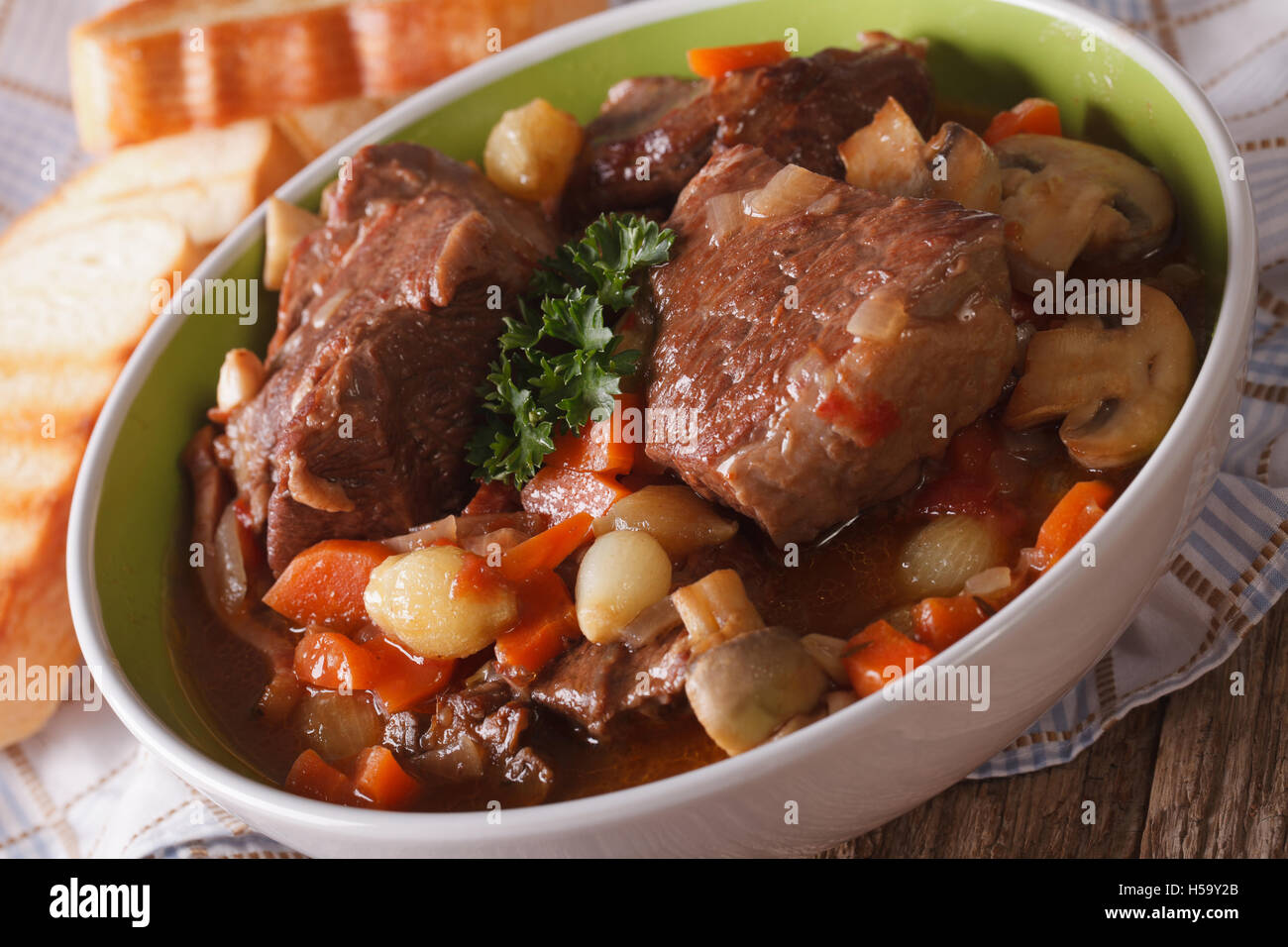 Traditional Beef Bourguignon with vegetables close-up in a bowl on the table. horizontal Stock Photo