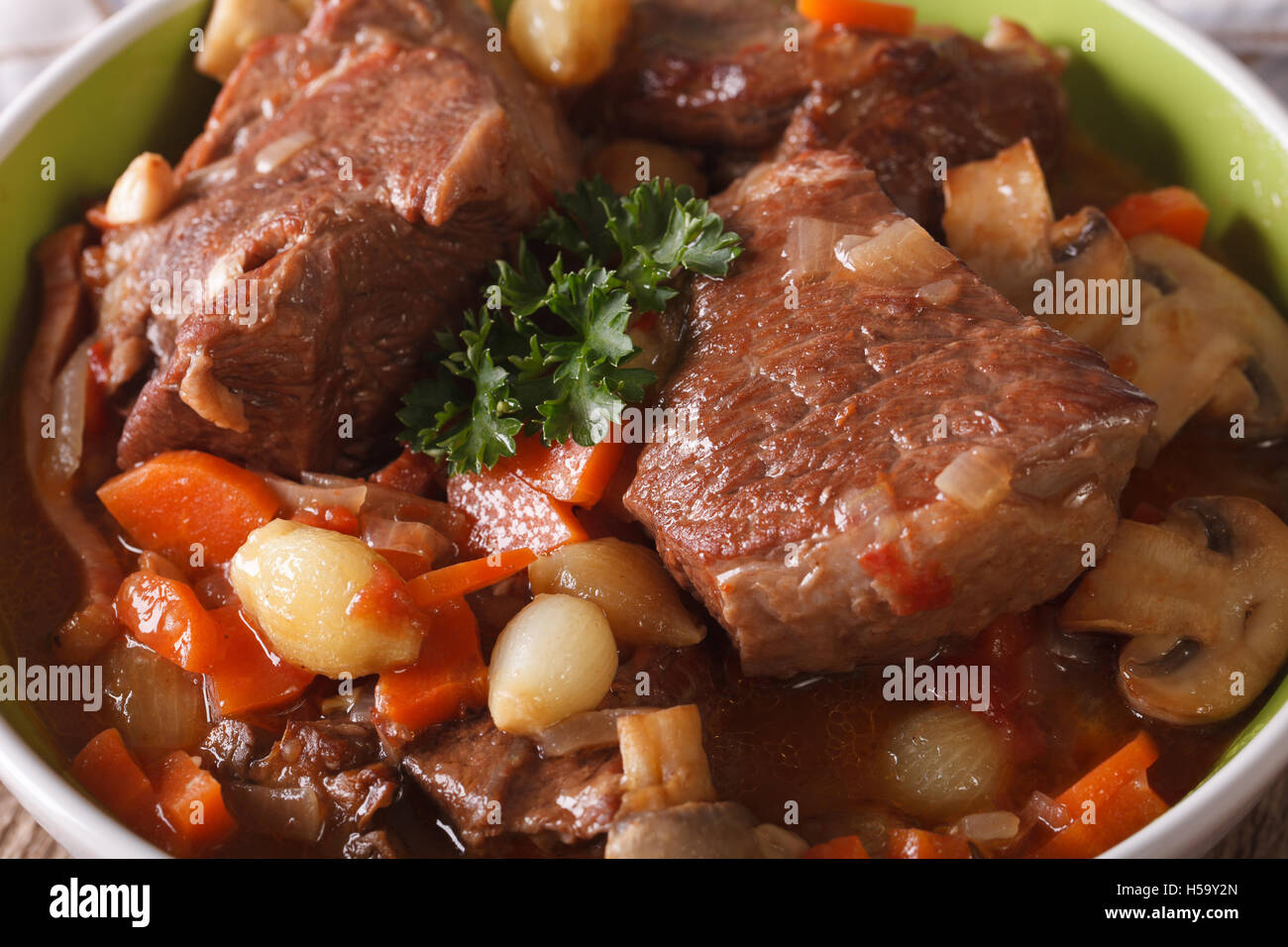 Traditional Beef Bourguignon in a bowl macro. horizontal Stock Photo