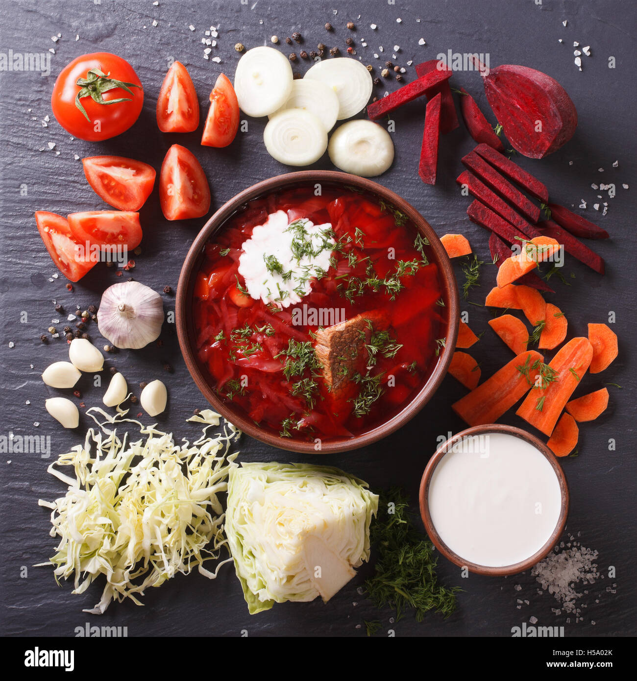 Ukrainian borsch soup with ingredients on slate board closeup. view ...