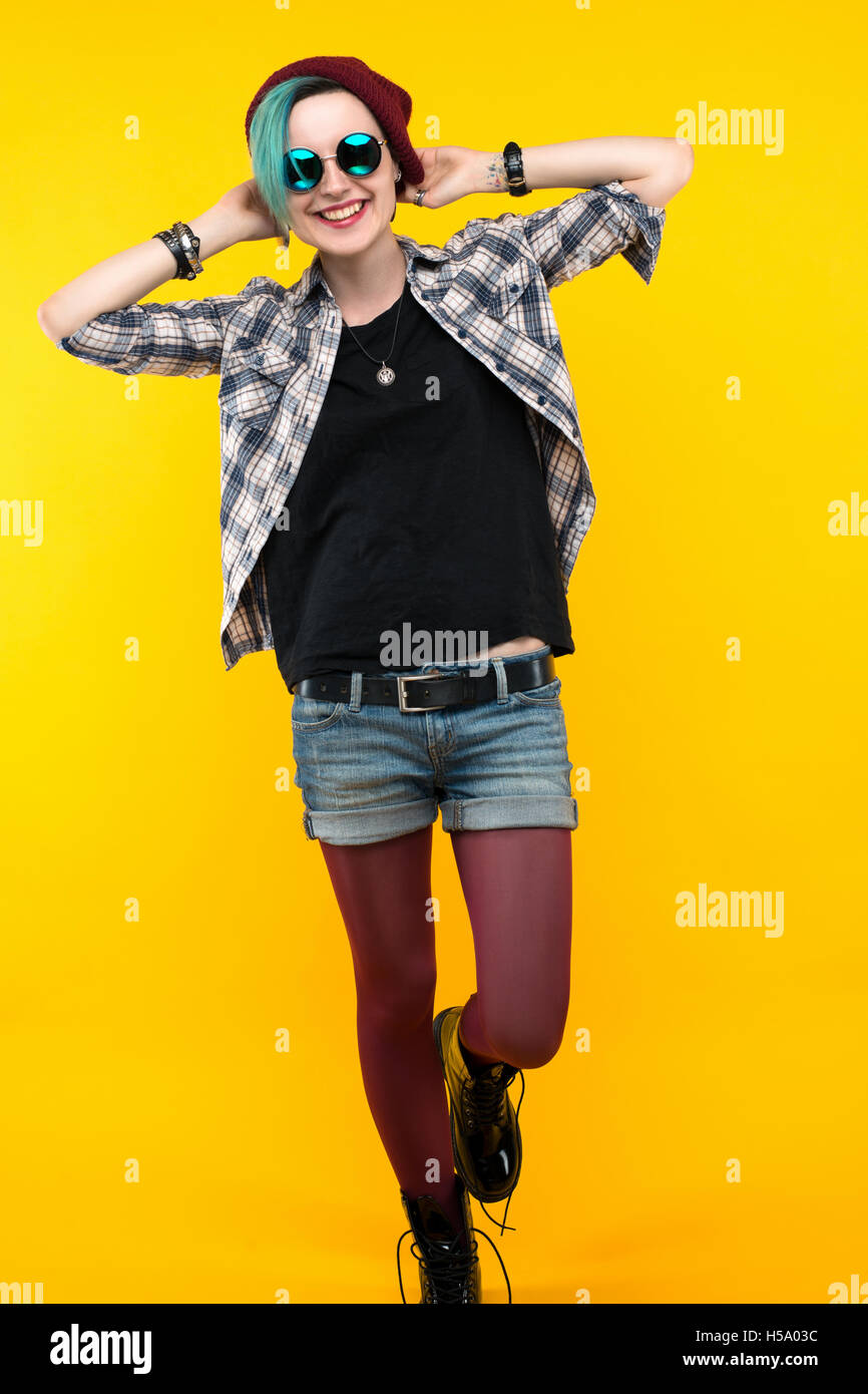 creative person style on yellow background. modern teenager. colour / colorful hairstyle Stock Photo