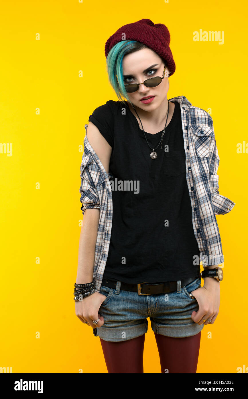 creative person style on yellow background. modern teenager. colour / colorful hairstyle Stock Photo
