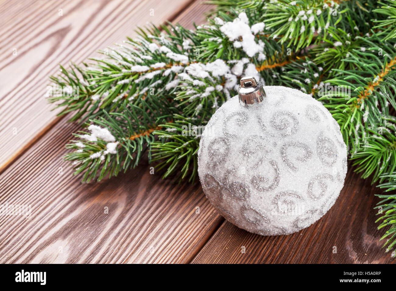 Christmas Bauble Decor And Tree On Wooden Table Stock Photo