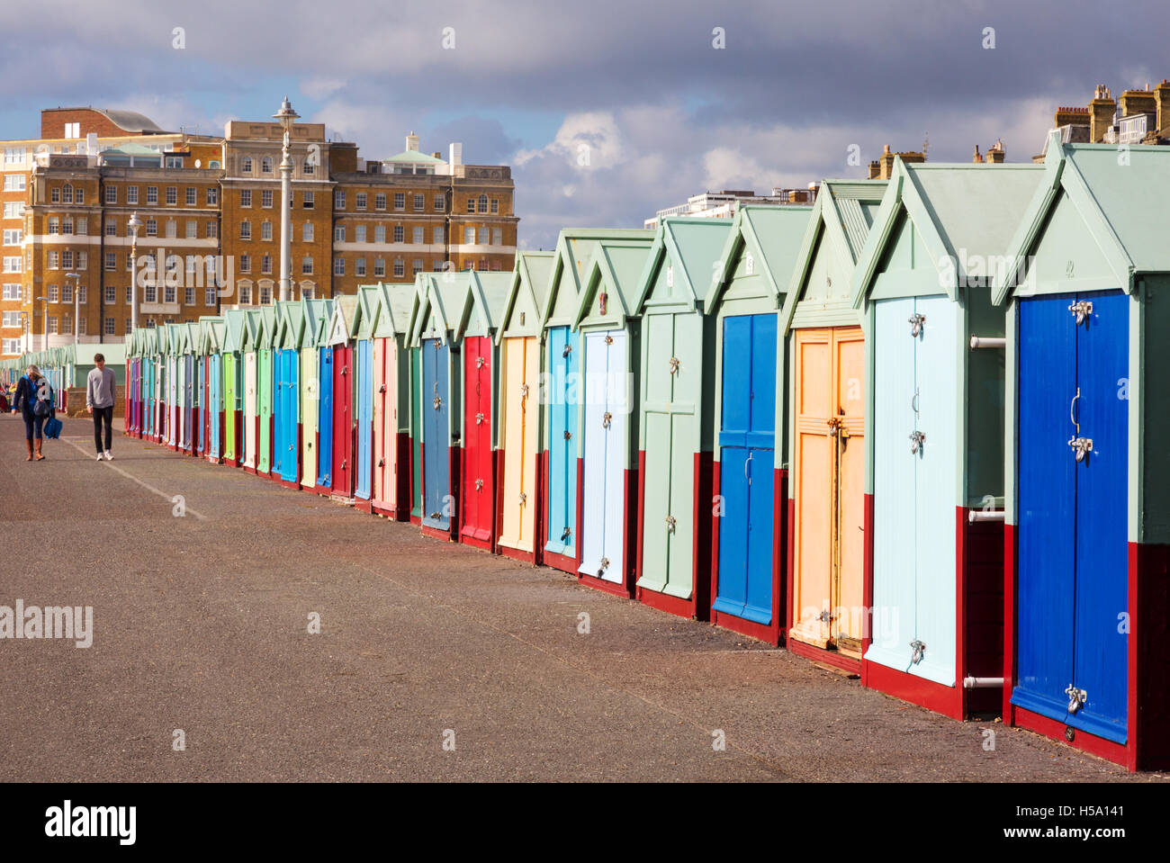 Brightly coloured row of beach huts, Brighton seafront, Brighton, East Sussex, UK Stock Photo