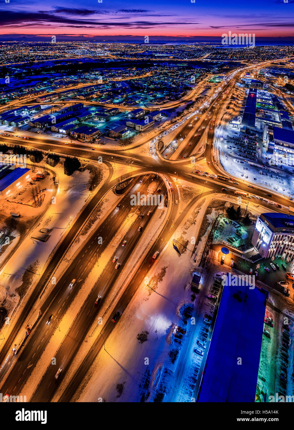 Top view of roads, homes, buildings at twilight, wintertime, Reykjavik, Iceland. This image is shot with a drone. Stock Photo