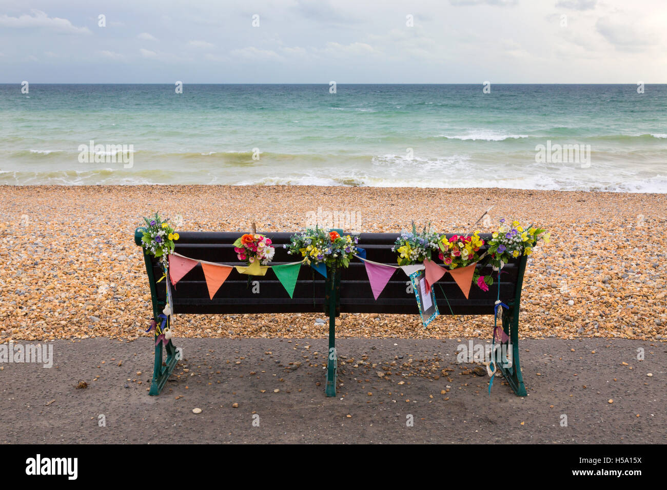 Memorial bench, Brighton promenade on the seafront, Brighton Sussex UK Stock Photo