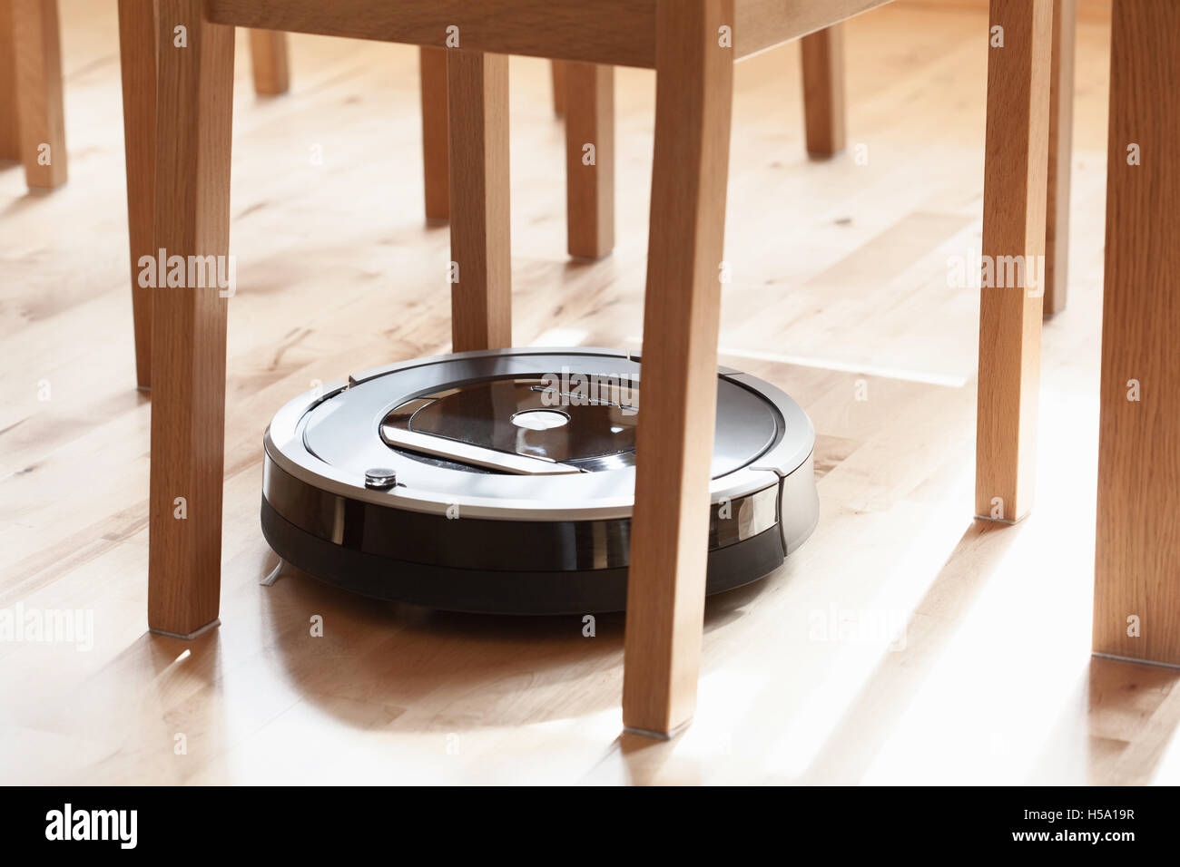 robotic vacuum cleaner on laminate wood floor smart cleaning technology