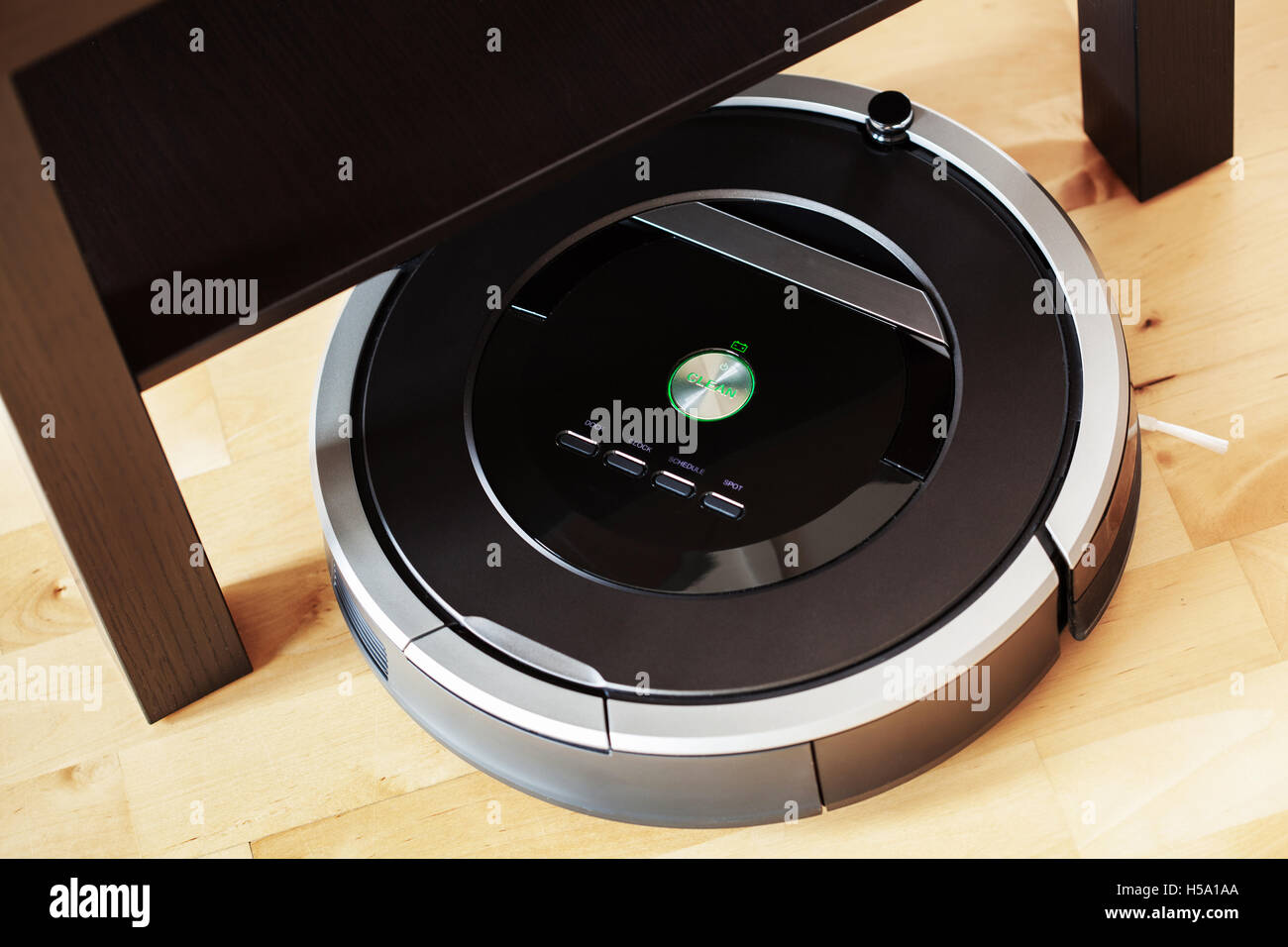 robotic vacuum cleaner on laminate wood floor smart cleaning technology