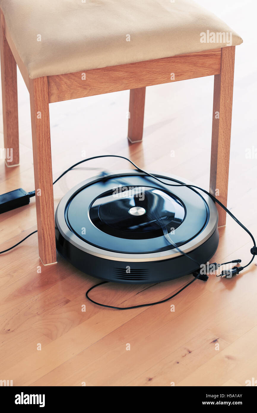robotic vacuum cleaner on laminate wood floor smart cleaning technology