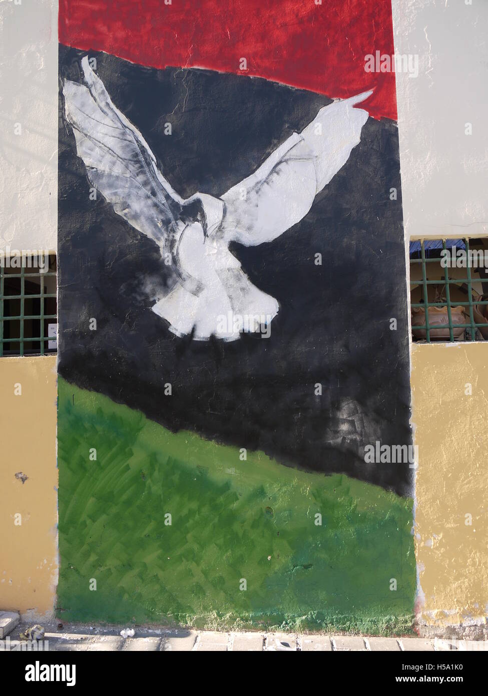 Painting on a wall of Tripoli celebrates the end of rebellion in Libya against regime of Muammar Gaddafi Stock Photo