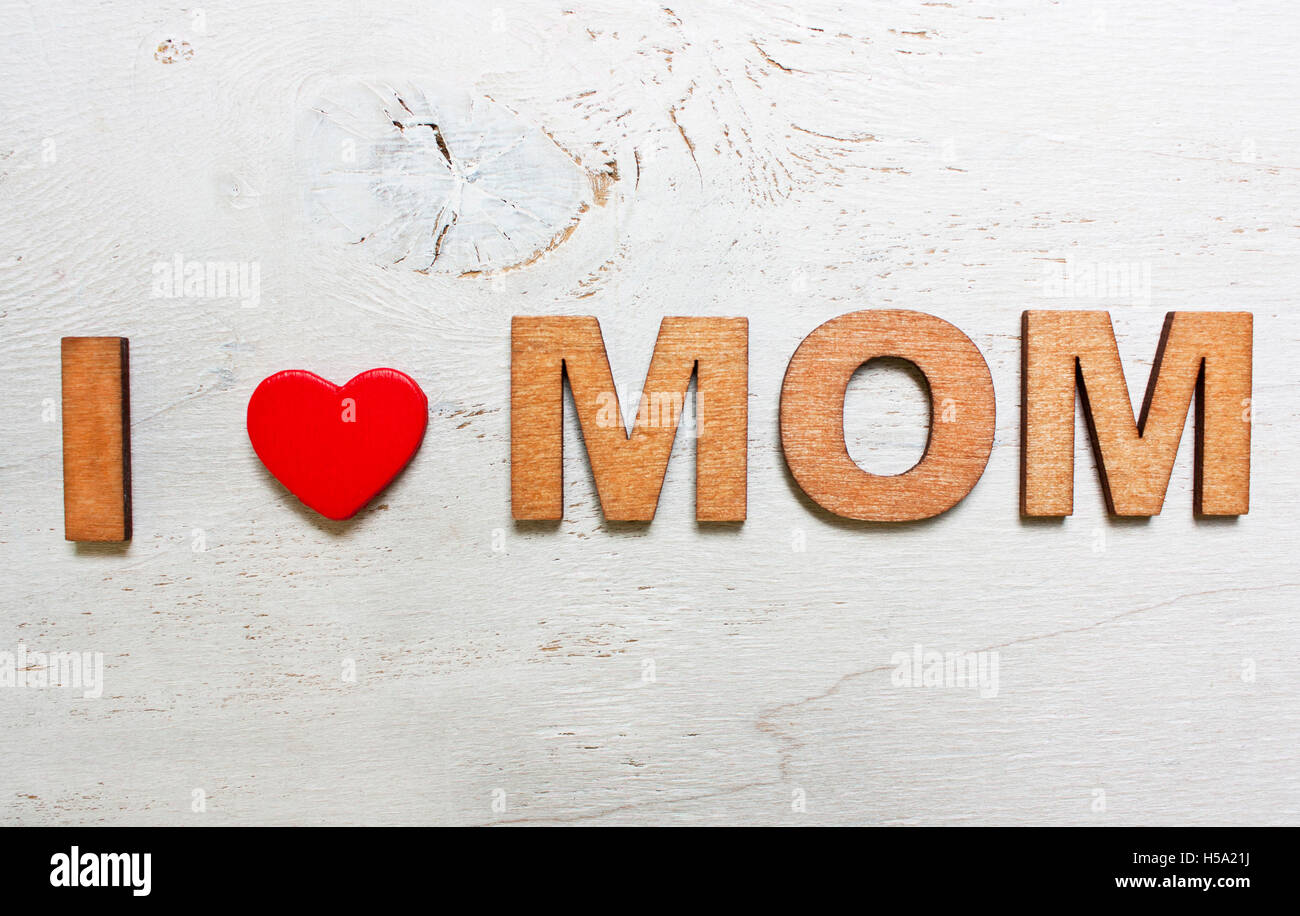 I love mom with wooden letters on an old white wooden background Stock Photo