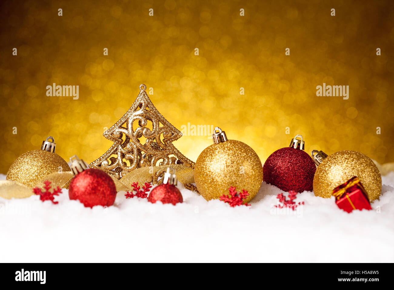 Golden christmas fir tree decoration with gold and red ornaments Stock Photo