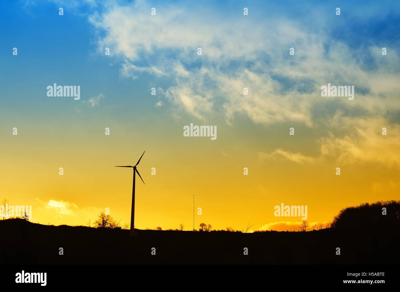 landscape with wind turbine and cloudy sky Stock Photo - Alamy