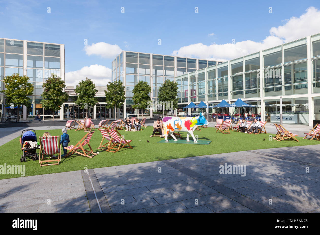People sitting in deckchairs in the courtyard of Milton Keynes largest