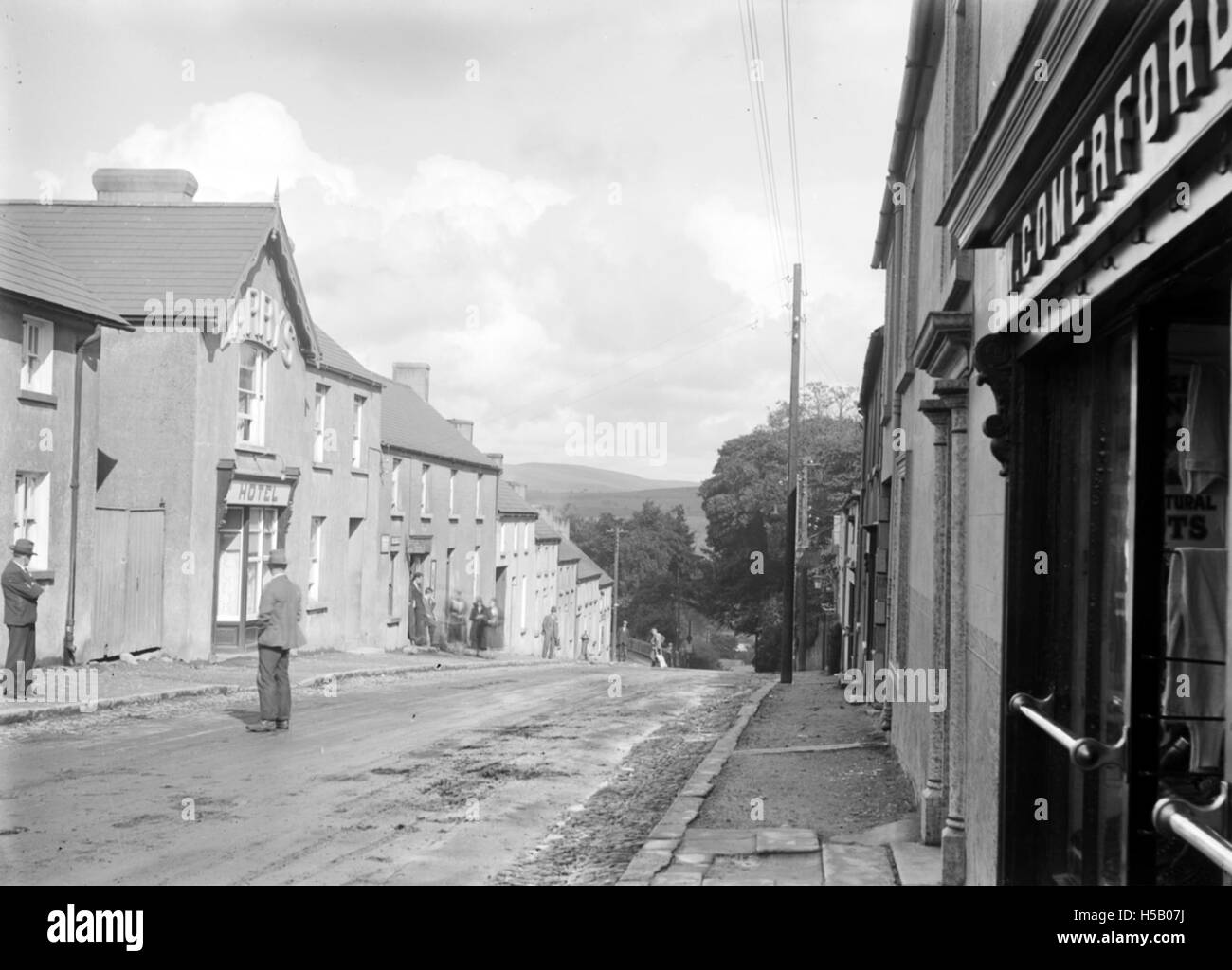 View of a village street, with pedestrians, in an unidentified location = Rathdrum, Co. Wicklow¡ Stock Photo