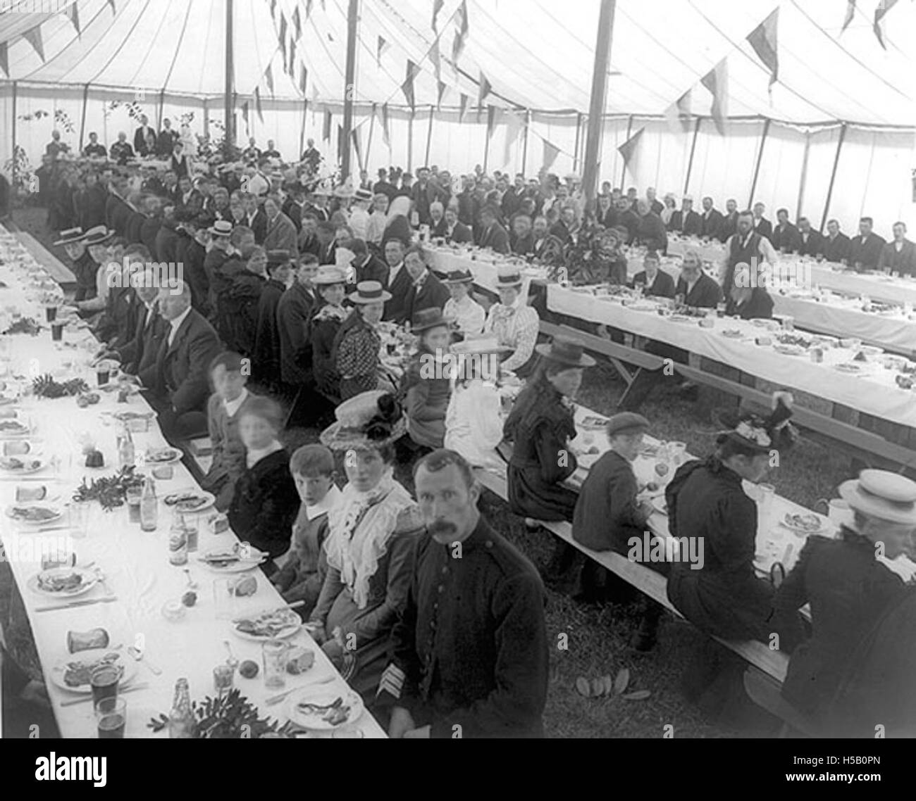 Tenants at tables in tent, Power Hall, Snowhill, Co. Kilkenny Stock Photo