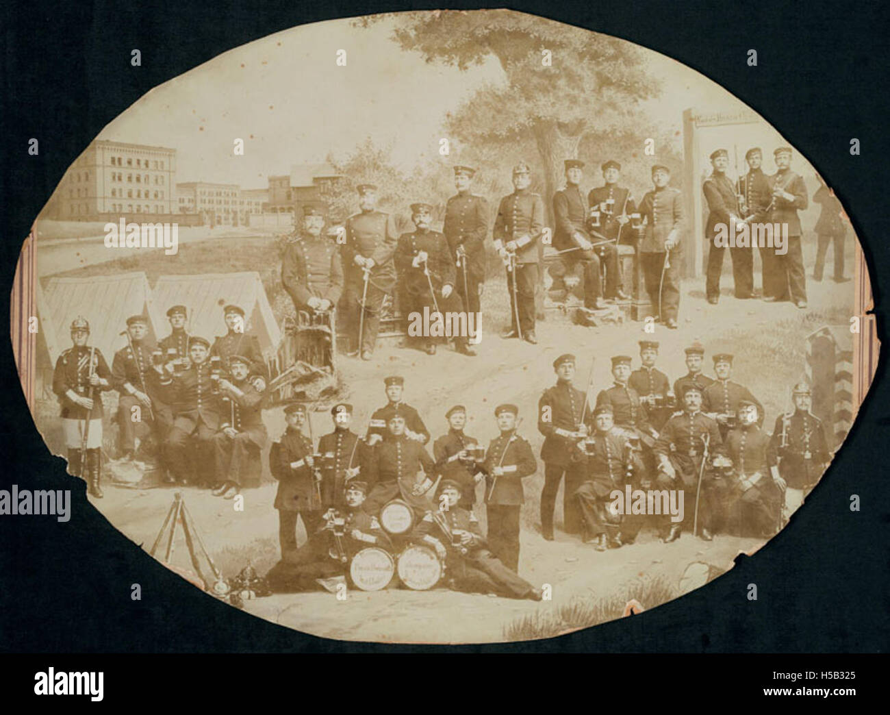 Photo collage of reserve soldiers posing holding swords and pints of beer Stock Photo