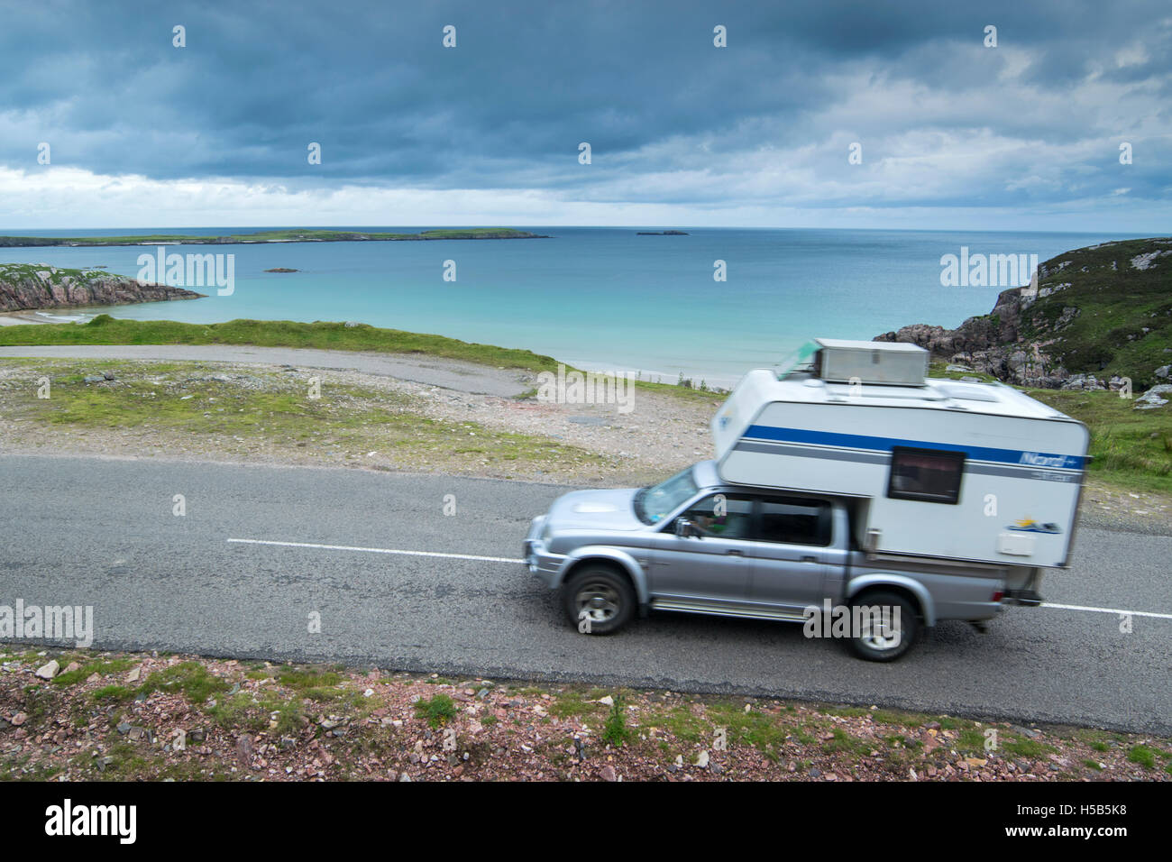 Camper van driving on the North Coast 500 scenic route near Durness in Sutherland, Scotland Stock Photo