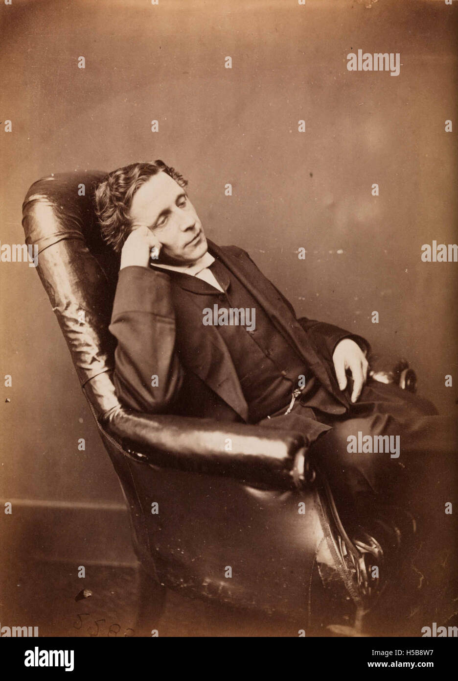 This portrait of Charles Lutwidge Dodgson, known as Lewis Carroll, was taken around 1875. Carroll was an English writer, best known for his works 'Alice's Adventures in Wonderland' and 'Through the Looking-Glass.' Stock Photo