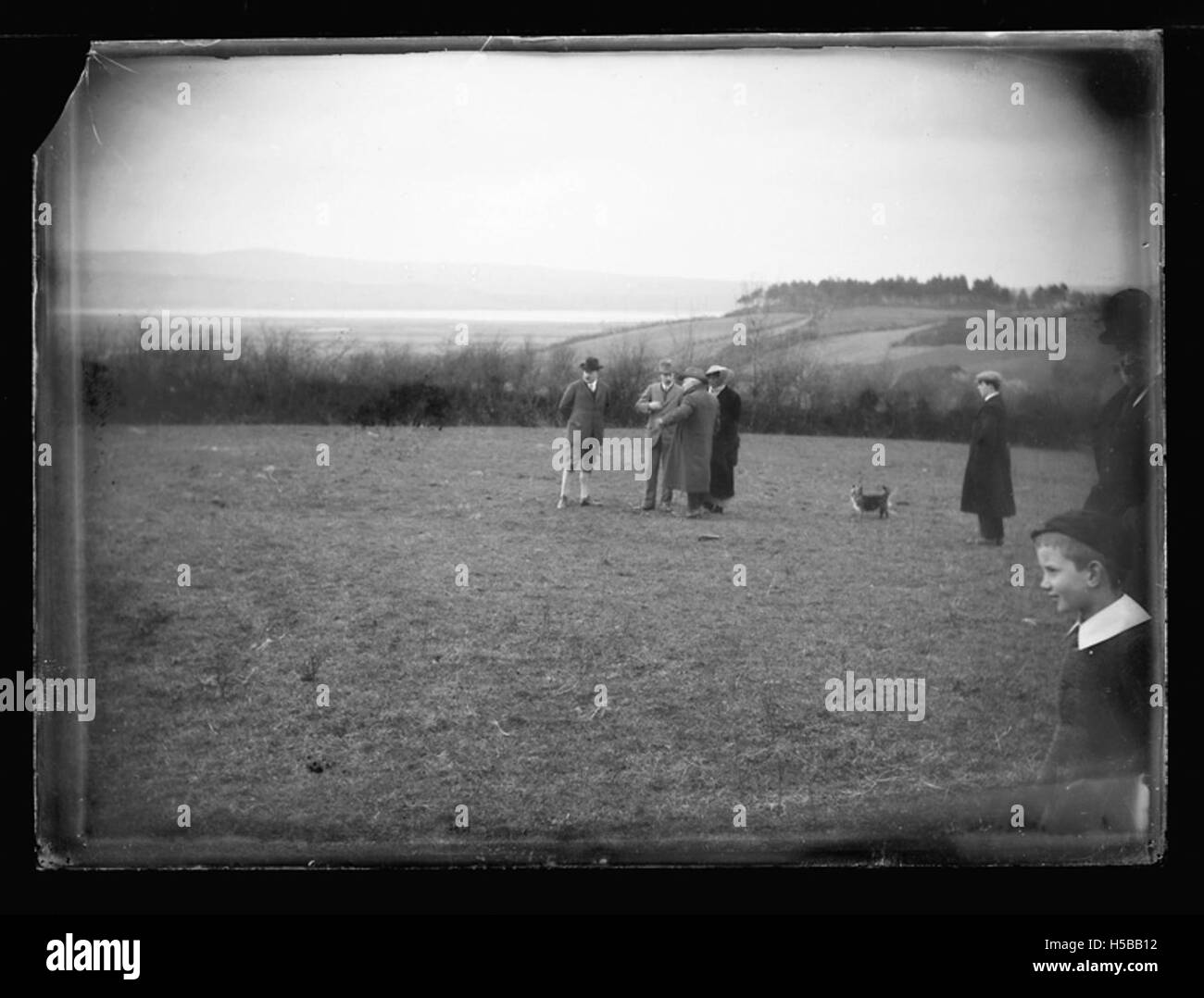 Photograph depicting two individuals engaged in conversation in a rural ...