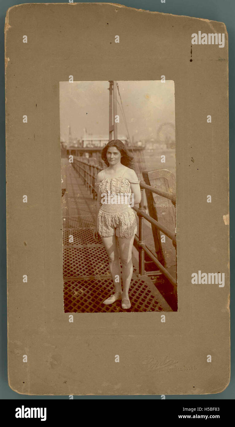 This photo captures Beatrice Kerr standing on a pier, possibly by the ...