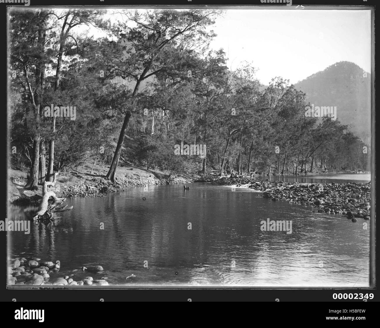 This riverscape likely depicts the Hawkesbury River in New South Wales, Australia, captured between 1880 and 1909. The image highlights the natural beauty and historical significance of the river during that period. Stock Photo
