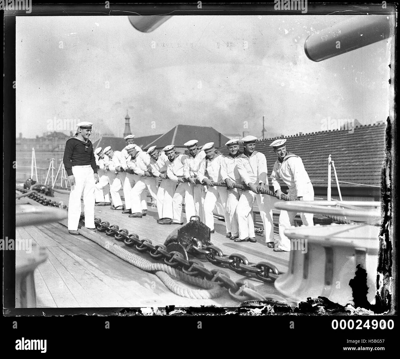 German naval sailors pulling on a rope, tug o' war style, on aft deck of KOLN Stock Photo