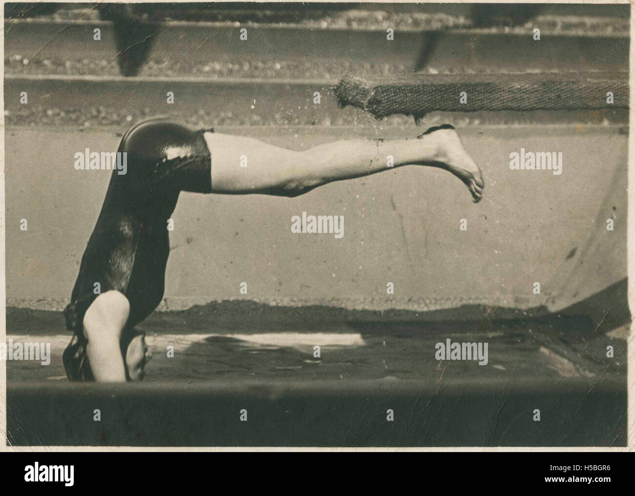 A woman, possibly Beatrice Kerr, is shown diving into water, captured ...