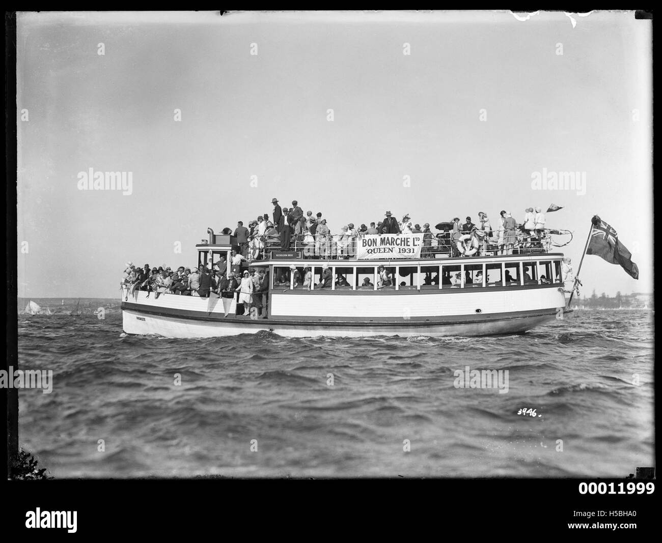 Nicholson Bros ferry, packed with spectators on Sydney Harbour Stock