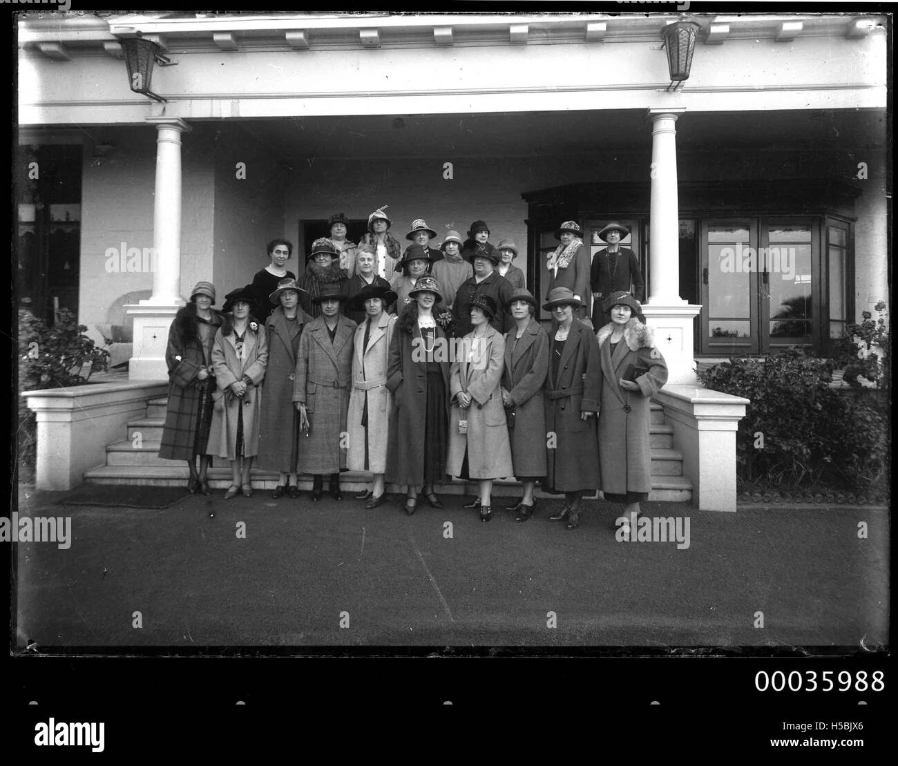 A group portrait from around 1925 shows women posing near the entrance ...
