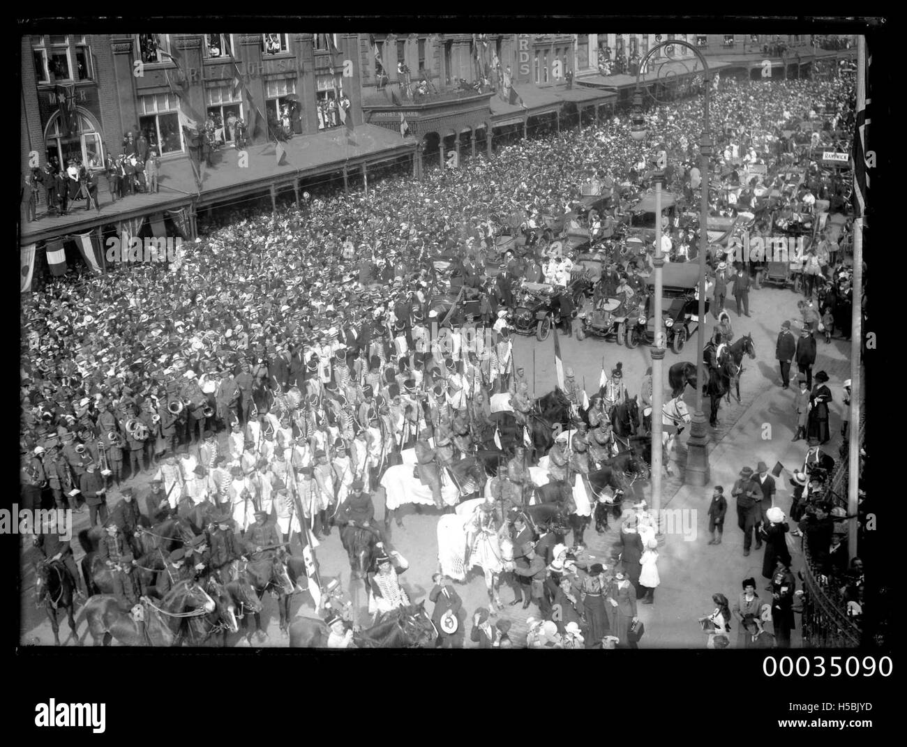 The image shows Australian servicemen participating in a victory parade in Sydney, as part of post-war celebrations. The photo is part of the Hood Collection, documenting significant historical events in Australia. Stock Photo